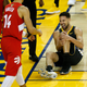 Klay Thompson of the Golden State Warriors reacts after hurting his leg in the second half during Game Six of the 2019 NBA Finals against the Toronto Raptors on June 13, 2019 in Oakland, Calif.